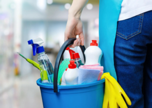 A person holding a blue bucket filled with various cleaning supplies for PAP-Cleaning Services in Fort Lauderdale, FL.
