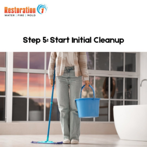 A person mopping a floor with a bucket for initial water damage cleanup, a service by Restoration 1 of NWA in Bentonville, AR.