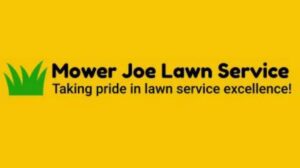 A person using a string trimmer to edge grass around a tree for Mower Joe Lawn Service in Omaha, NE.