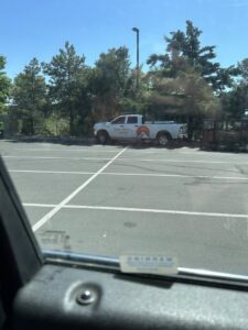 A person using a snow blower to clear a snow-covered path or sidewalk for Town & Country Landscape Maintenance in Reno, NV.