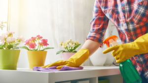 A professional cleaner in yellow gloves wiping a surface for House Cleaning Services Summerlin Nevada, Las Vegas, NV.