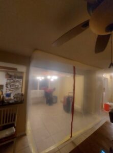 Plastic sheeting used to create a containment zone during water damage restoration, ensuring controlled drying and remediation by Standard Restoration in Salt Lake City, UT.