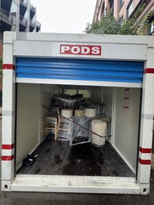 A PODS container partially loaded with furniture and wrapped items by PittMovers in McKees Rocks, PA
