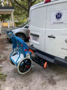 A Pool Services of Wilmington service van with cleaning equipment attached, ready for jobs in Wilmington, NC.