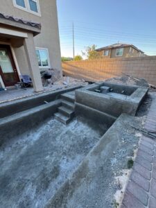 A swimming pool under construction, showing the concrete shell and steps poured by Greencare.net POOL Builder in Las Vegas, NV