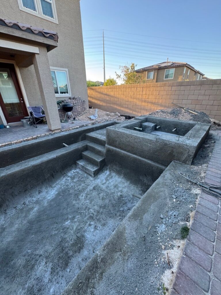 A swimming pool under construction, showing the concrete shell and steps poured by Greencare.net POOL Builder in Las Vegas, NV