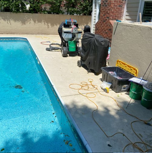 Equipment set up for concrete repair or slab lifting work around a pool deck by HNO Waterproofing & Slab Lifting Pros in Concord, NC.