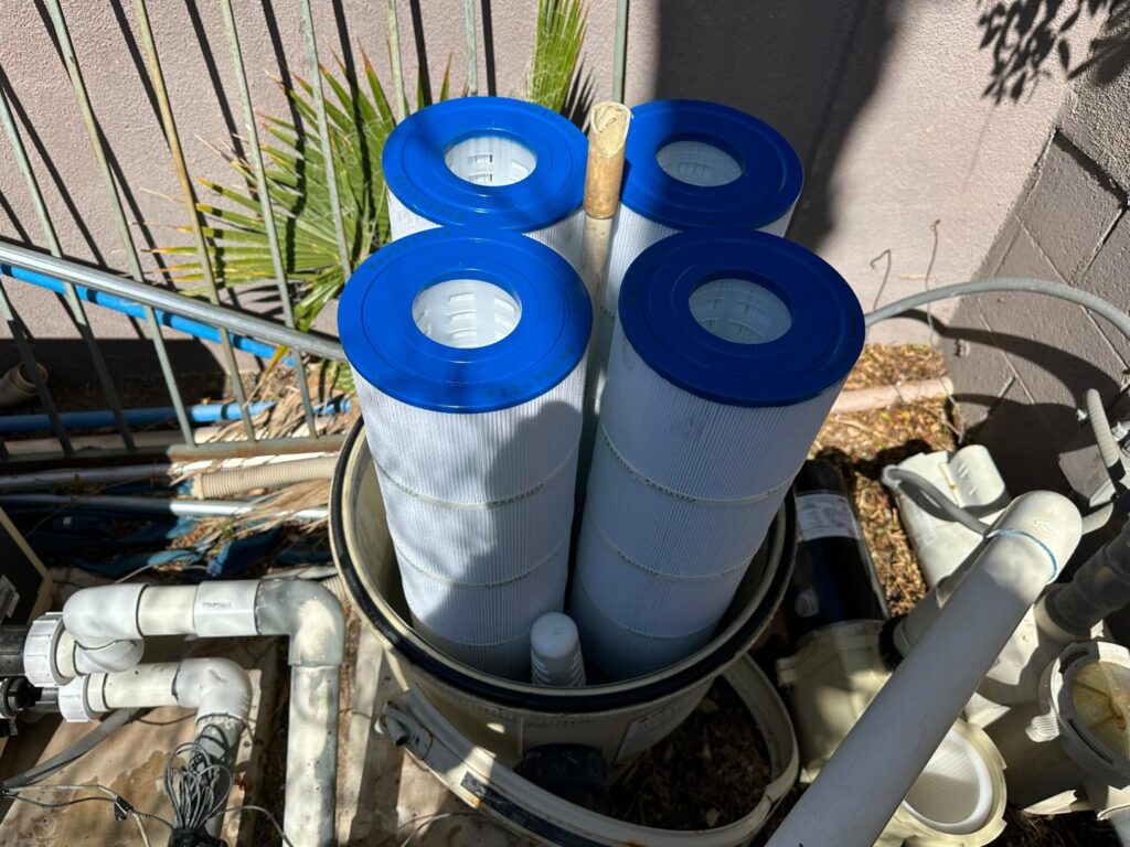 Multiple pool filter cartridges being replaced or cleaned by Overflow Poolz LLC in Las Vegas, NV.