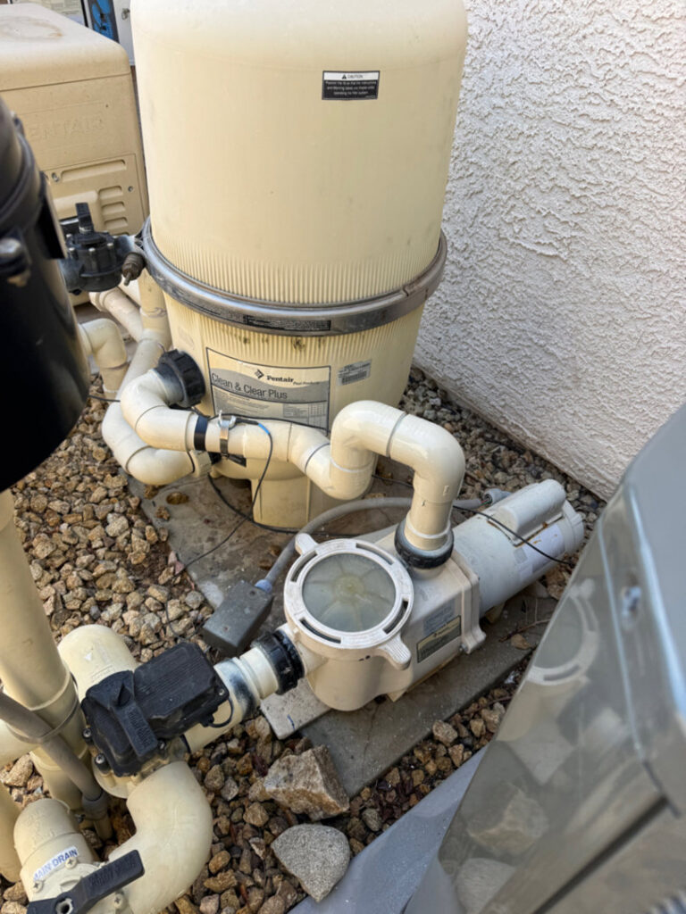 A pool filtration system with pump and pipes, expertly installed by Purpose Pools in Henderson, NV.
