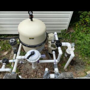 A close-up view of a pool filtration system, indicating maintenance and repair services by Chlorine Clean Pool Services in Wilmington, DE.