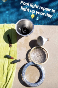 Pool light repair components and tools laid out next to a pool by Dave Rubinson Pools in Las Vegas, NV.