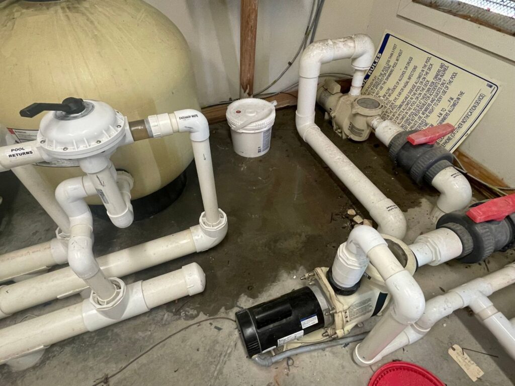 Pool pump and filtration system plumbing, maintained by Pool Services of Wilmington in Wilmington, NC.