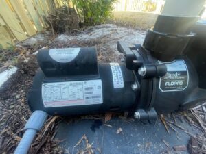 A pool pump motor, indicating maintenance services provided by Pool Services of Wilmington in Wilmington, NC.
