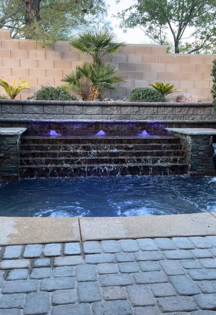 A pool technician from Aloha Pool Cleaning LLC servicing a pool pump, demonstrating expert equipment maintenance in Las Vegas, NV.