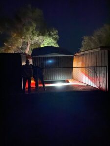 CC Wrecker Service team members working at night to place a portable metal storage building in Corpus Christi, TX.