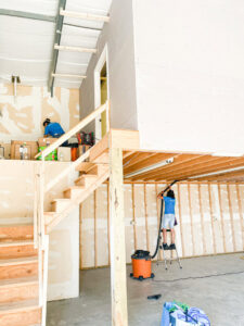 House cleaners from So Clean Cleaning Services performing post-construction cleanup in a residential building in East Providence, RI.