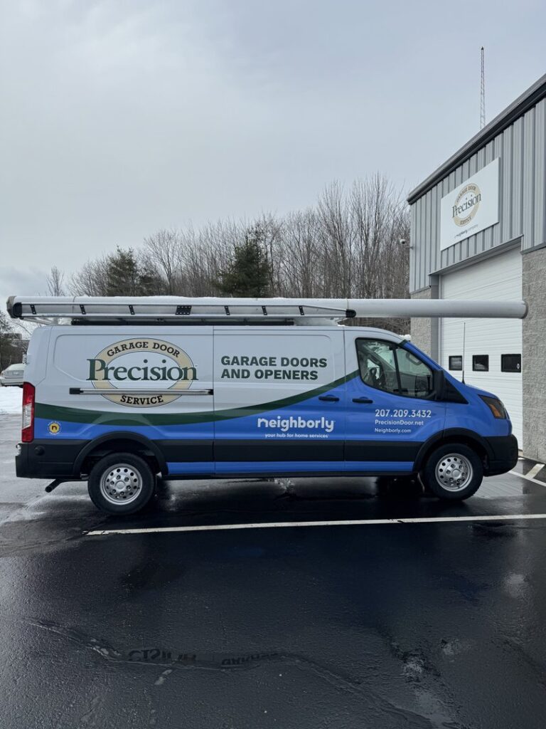 A Precision Garage Door Service of NC van parked outside a commercial building in Morrisville, NC.