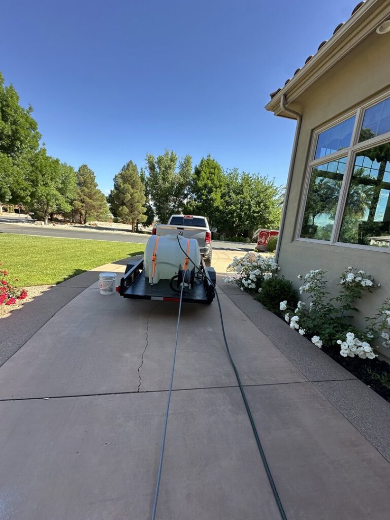 Pressure washing equipment and trailer set up on a residential driveway by Farki Pressure Washer LLC in Mesquite, NV