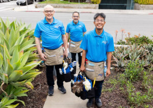 The Presto Cleaning team, equipped with cleaning supplies, standing outside a home in San Diego, CA.