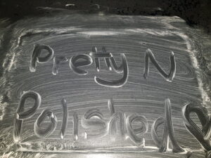 The business name 'Pretty N Polished' written in cleaning foam, showcasing attention to detail by Pretty & Polished Cleaning Services in Sandy, OR.