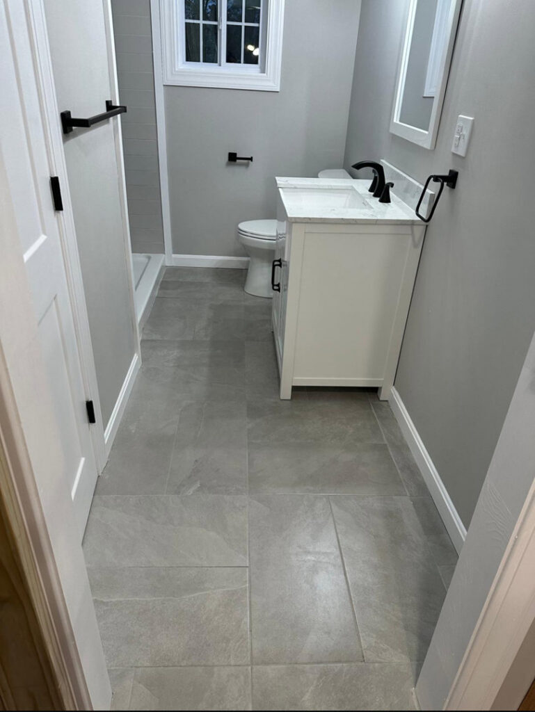 A pristine and well-maintained bathroom, showcasing the high-quality cleaning service provided by Mary's Sparkling Cleaning in Fall River, MA.