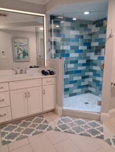 A pristine bathroom featuring a modern tiled shower and clean vanity, expertly cleaned by Cate's Cleaning Company in Derry, NH.