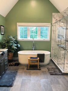 A pristine bathroom featuring a clean freestanding tub and glass shower, maintained by Polished Housekeeping Services in Londonderry, NH.