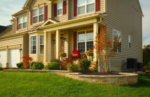 A pristine front lawn with attractive landscaping, showcasing the work of Bailey's Lawn and Landscape in Smyrna, DE.
