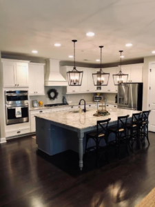 A pristine, modern kitchen with a large island, showcasing the cleaning services of Carolina Clean SC, LLC in Rock Hill, SC.