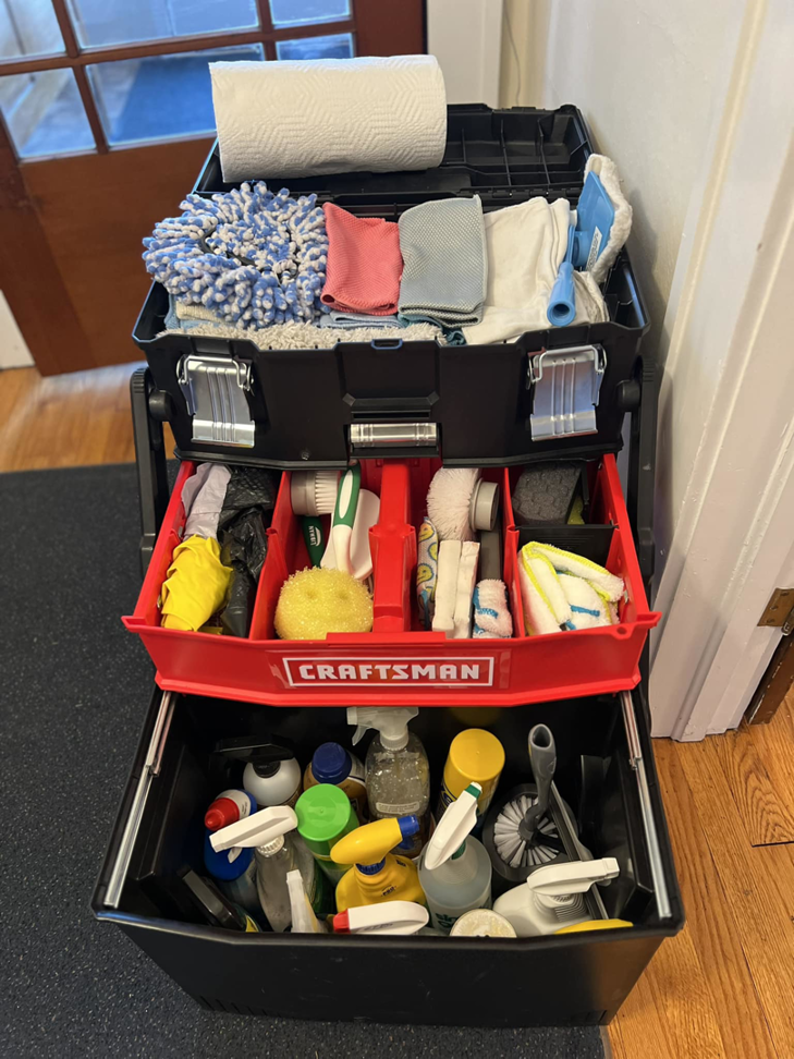 A professional cleaning supplies kit with various tools and products used by Stay at Home Maids in Roanoke, VA.