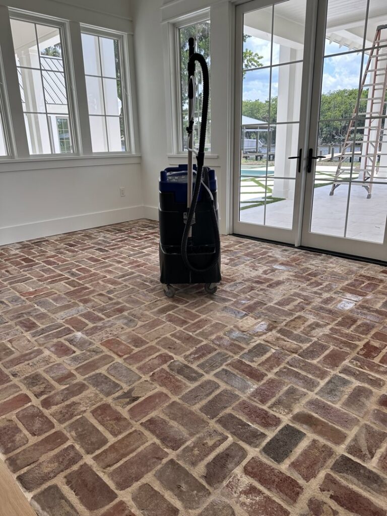 Professional floor cleaning equipment on a brick floor, indicating deep cleaning services by Simply Clean Jax in Jacksonville, FL.