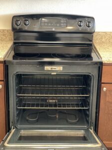 A professionally cleaned oven with sparkling racks and interior, highlighting deep cleaning services by 307 Maid in Cheyenne, WY.