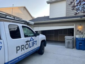 A ProLift Garage Doors of Canyon County service truck parked at a residential home with the garage door partially open in Nampa, ID.