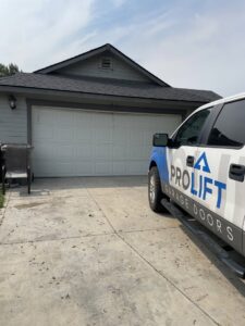 A ProLift Garage Doors of Canyon County service truck parked in front of a residential garage, ready for a service call in Nampa, ID.