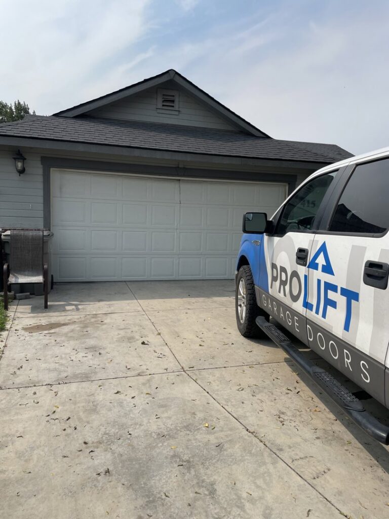 A ProLift Garage Doors of Canyon County service truck parked in front of a residential garage, ready for a service call in Nampa, ID.