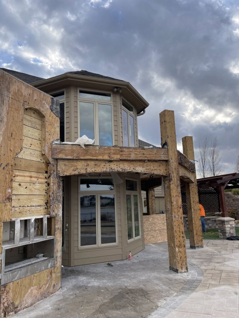 Residential deck undergoing partial demolition, showing exposed framing by Allis Demolition & Hauling LLC in Omaha, NE