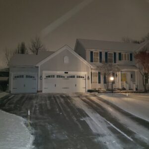 A residential driveway cleared of snow by Akron Lawn Care And Snow Removal in Akron, OH.