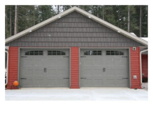 Two residential grey garage doors with decorative windows and hardware by Vertical Door Solutions in Sheridan, WY