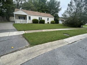 A residential lawn with a fresh cut and neat edges, demonstrating quality work by Mike's Lawn Care Service in Dover, DE.