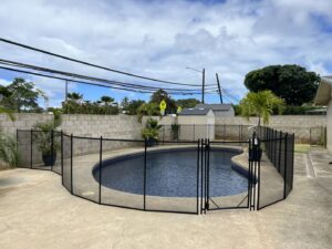 A residential pool fence installation by Guardian Pool Fence Systems of Hawaii, securing a backyard pool in Honolulu, HI.