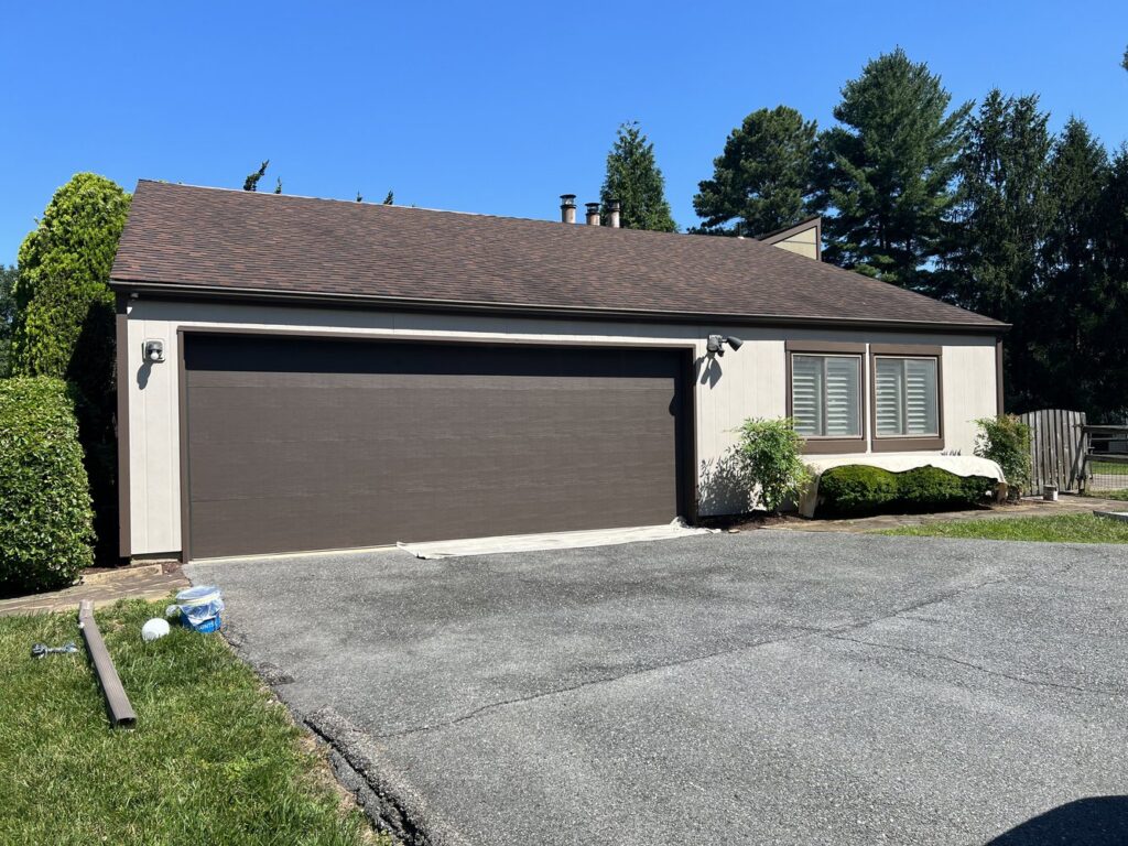 A residential home with new light-colored siding from Annapolis Painting Services Inc in Annapolis, MD