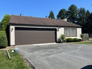 A residential home with new light-colored siding from Annapolis Painting Services Inc in Annapolis, MD