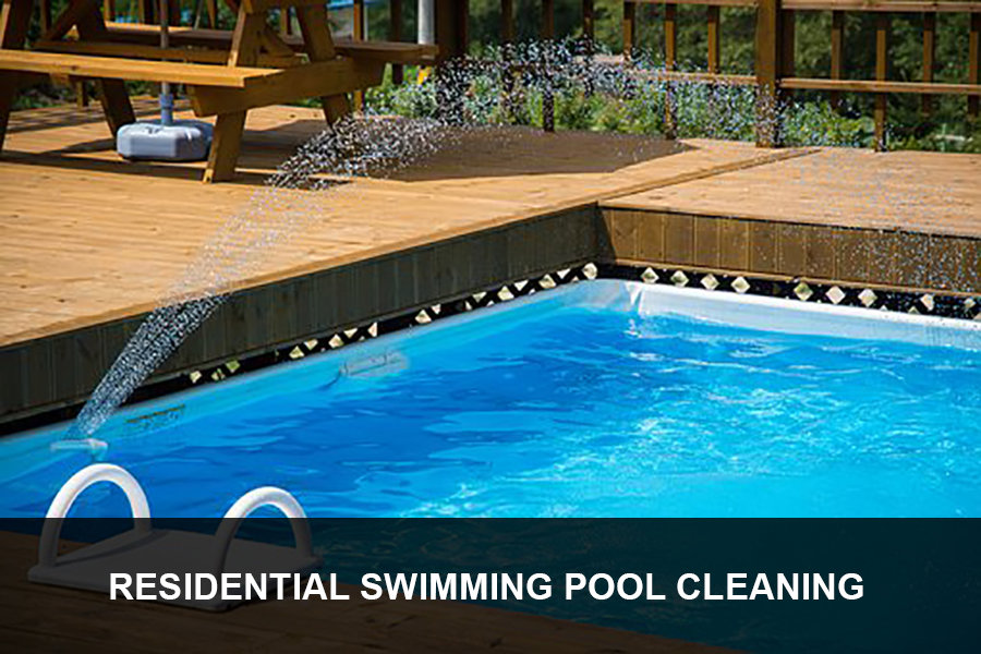 A pool vacuum cleaning a residential swimming pool, demonstrating services by Dave Rubinson Pools in Las Vegas, NV.