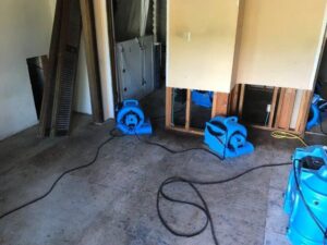 Residential room with walls removed and drying equipment for water damage by Complete Restoration and Construction, LLC in Yakima, WA