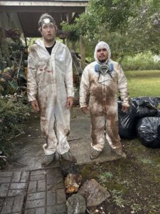 Restoration Xperts Emergency 24/7 technicians in soiled hazmat suits after completing a dirty water damage remediation job in Deerfield Beach, FL.