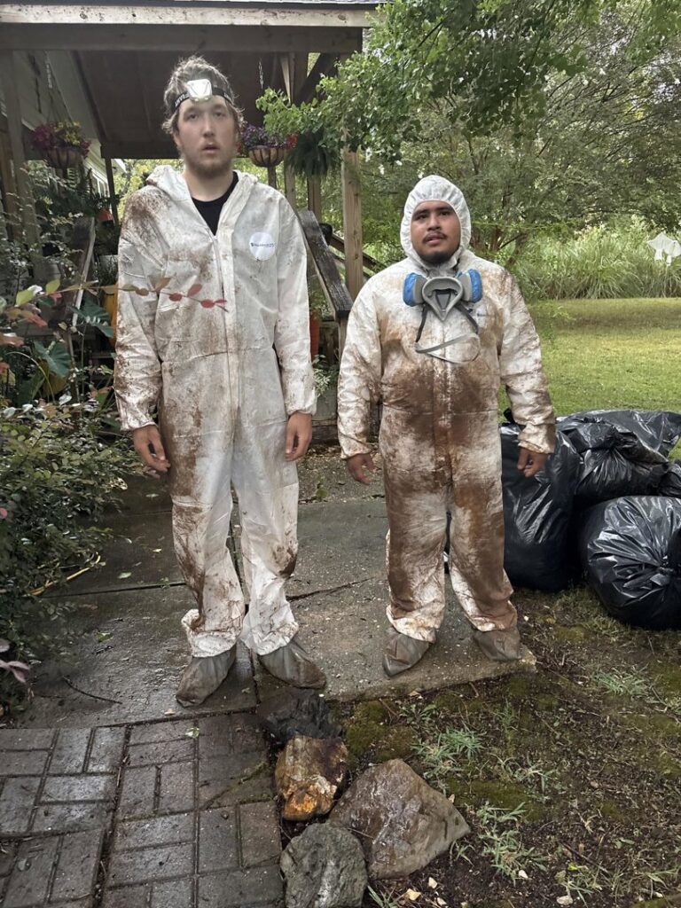 Restoration Xperts Emergency 24/7 technicians in soiled hazmat suits after completing a dirty water damage remediation job in Deerfield Beach, FL.