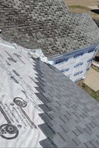 Roof replacement in progress with new shingles and underlayment, preventing water damage for Emanuel Roofing LLC in Huron, SD.