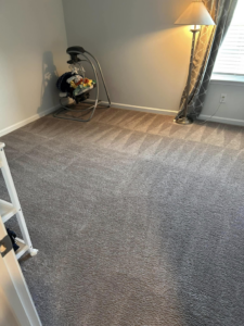 A room with a freshly vacuumed carpet, cleaned by Five Star Cleaning Service in Pasadena, MD.
