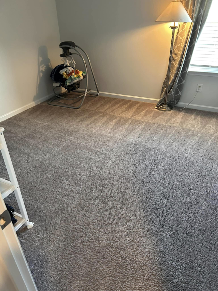 A room with a freshly vacuumed carpet, cleaned by Five Star Cleaning Service in Pasadena, MD.