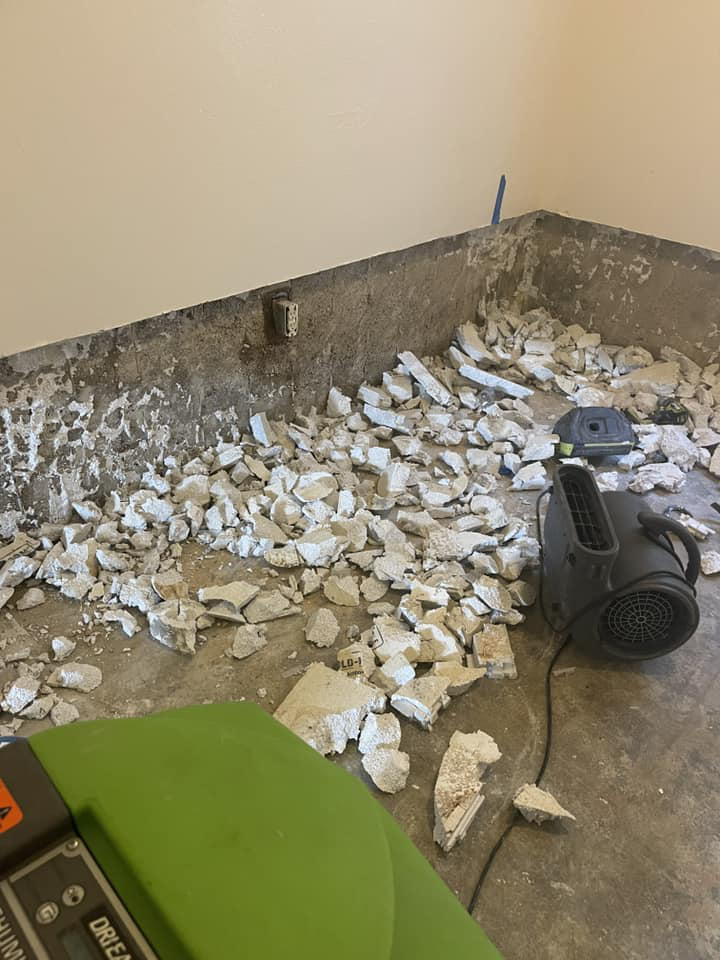 A room undergoing demolition and drying with specialized equipment after water damage at Absolute Water Mitigation & Restoration in Greeley, CO